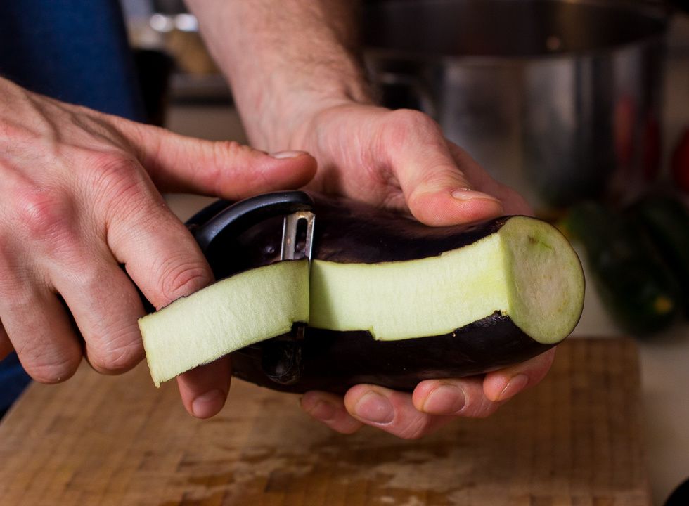Peel your eggplant or aubergine or whatever the heck you decide to call this lovely little bugger.