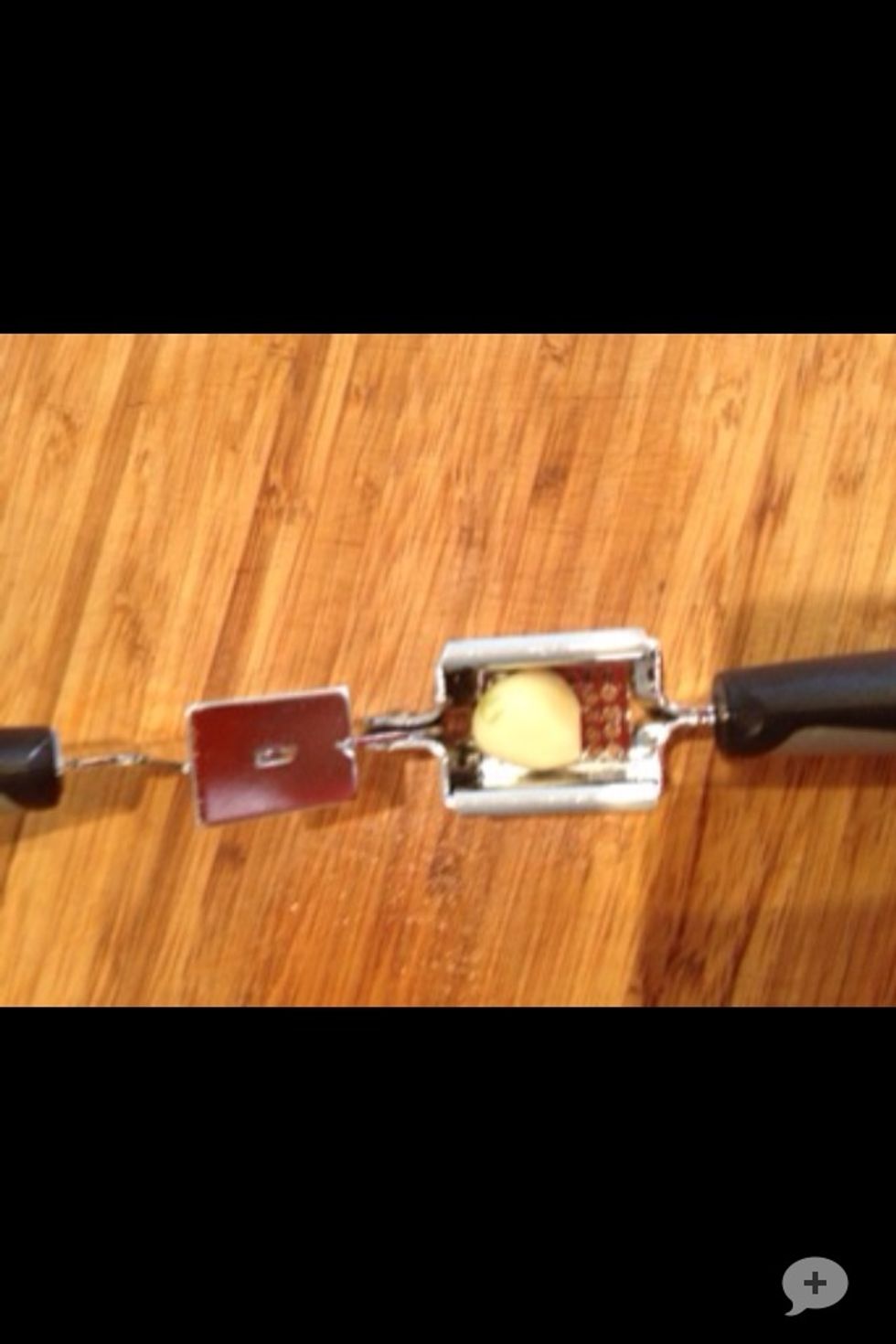 Peel your garlic then put it in your garlic press or chop it up