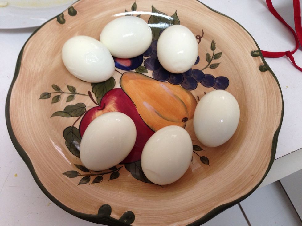Peel your hard boiled eggs.
