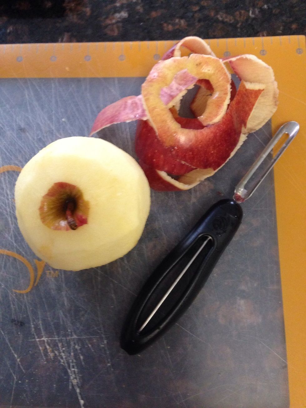 Peel your large organic red delicious apple.