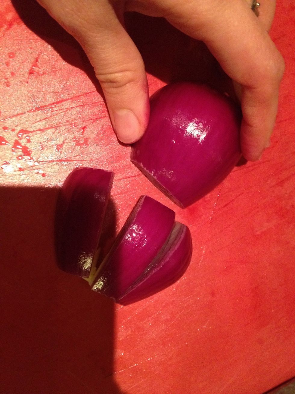 Peel your onion and cut in half, then cut into thirds lengthwise