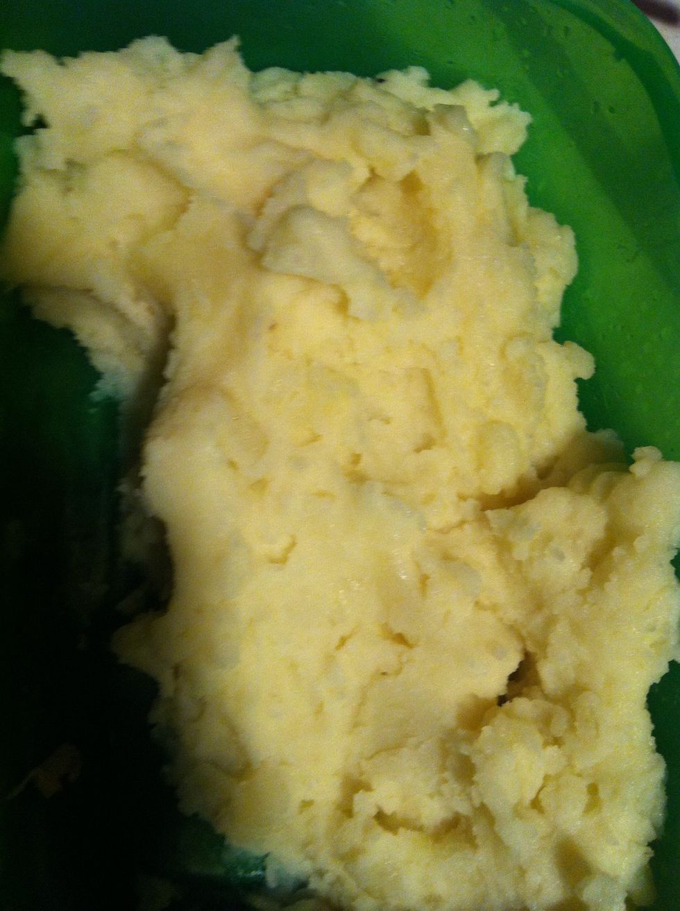 Peel your potatoes, boil in salt, mix the shredded Monterrey Jack cheese. The cheese helps keep potato inside the taco while frying.