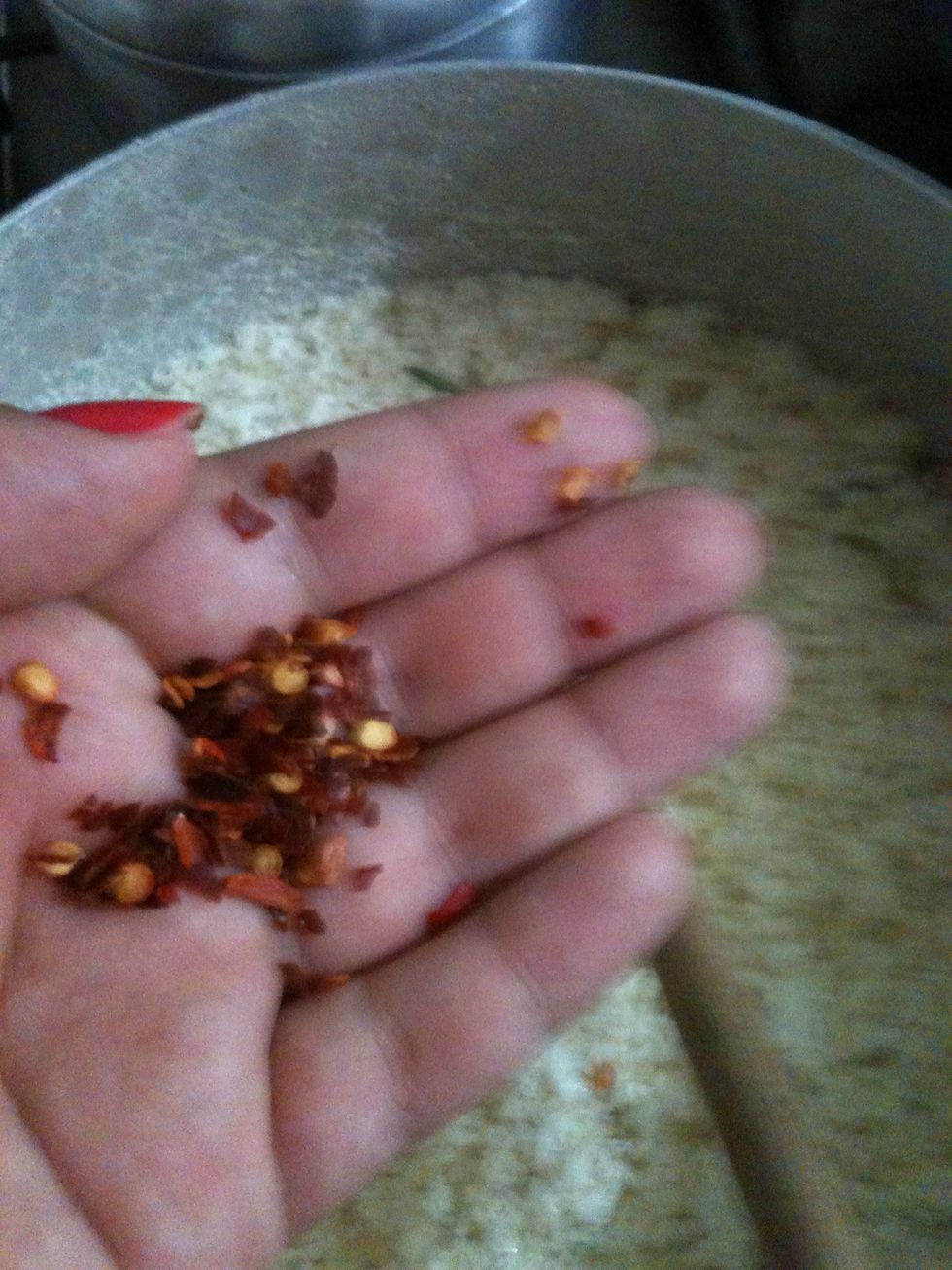 Pepper flakes and other spices of your taste. I added basil as well, but I couldn't take the pictures because I needed to be quick. Add the spices and close the pan.