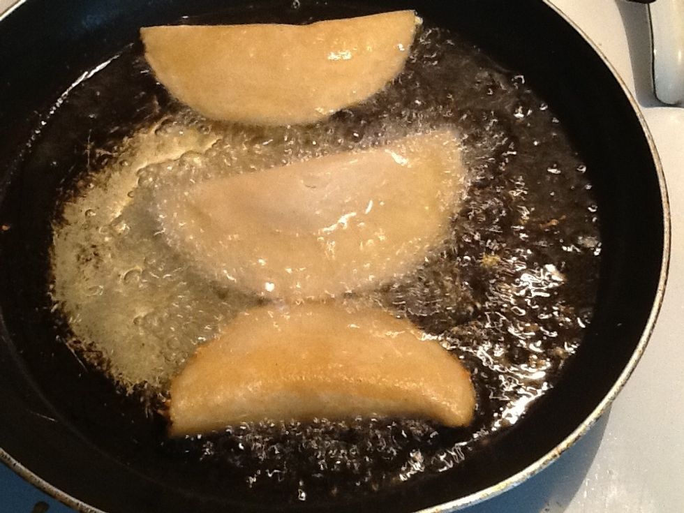 Per-heat your oil when hot place your quesadillas in oil cook until a golden brown then place them on a plate