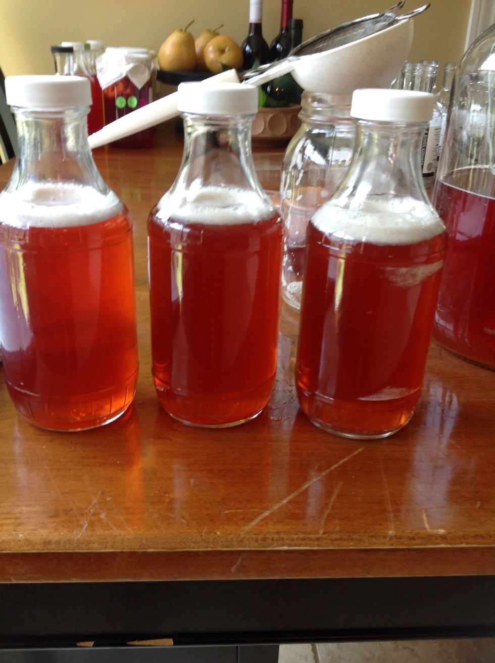 Periodically sample your brew and put in the refrigerator when you attain the desired flavor. The cold temperature will stop the fermentation process.