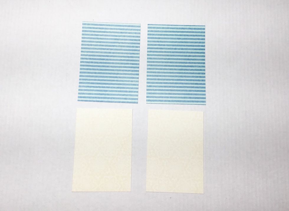 Photo mats. You will need 2 coloured patterned paper ones slightly larger then the cream ones as shown. You will need 4 photo mats in total.