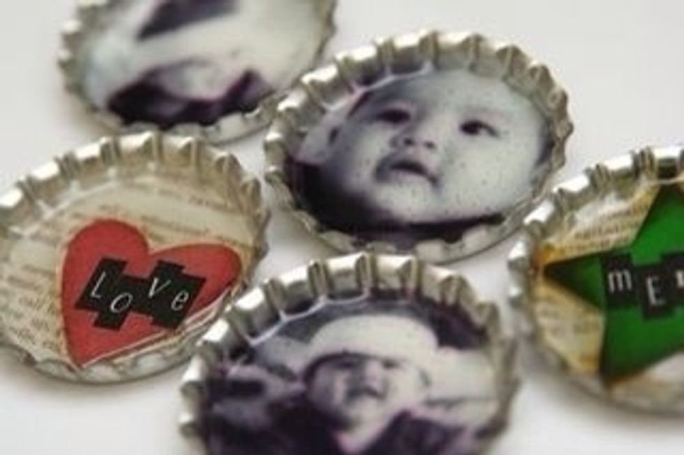 Photos also work well.  If you want to keep a photo in place, add a touch of hot glue to the back and tack in place before adding baubles and glitter.