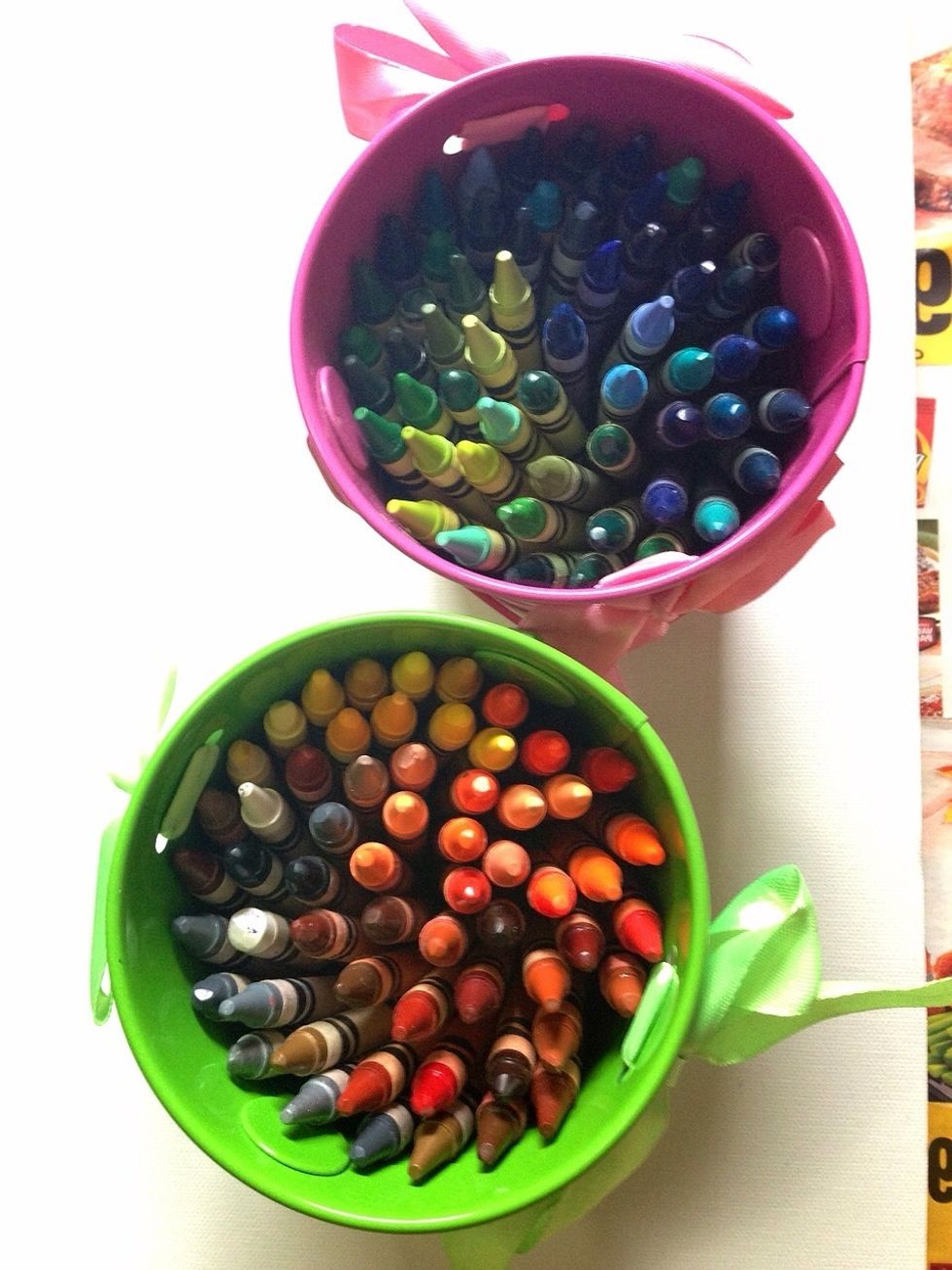Pick a theme of color you'd like to use. For instance, I want red so I will pick a variation of 10 red/orange crayons and cut them each in half.