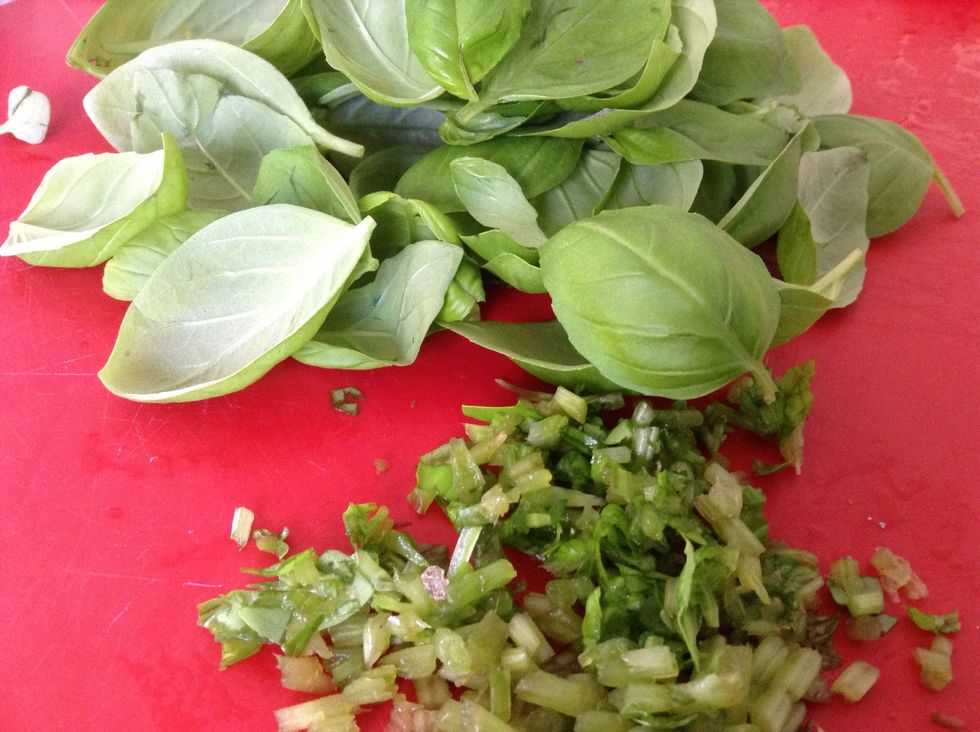 Pick basil leaves and finely chop the stalks