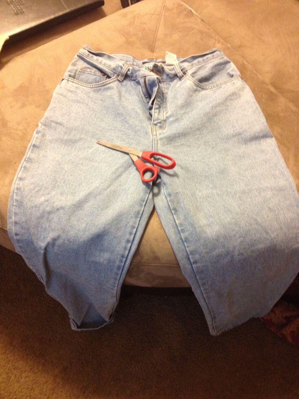 Pick out a pair of jeans that you no longer wear or picked up especially for this project. Try the pants on to get a good idea of where you would like to cut them. You can use a marker or stick pen.