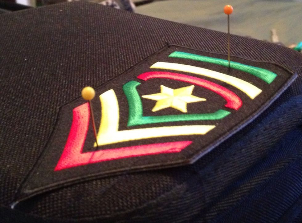 Pick out a patch, place it in the place you'd like to sew it and pin it in place.