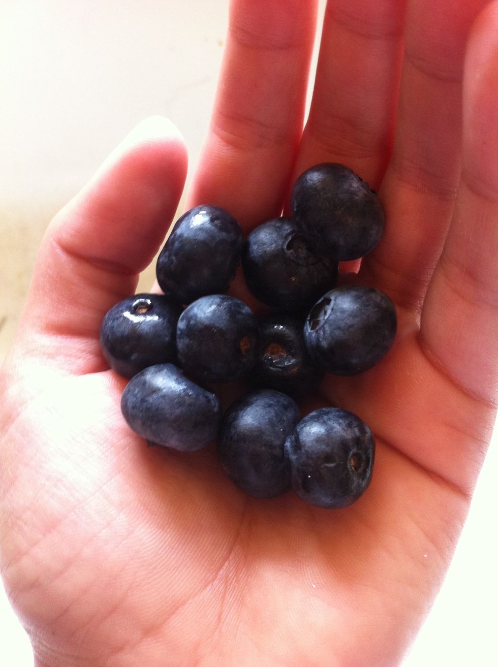 Pick out as many blue berries as you want, wash them, then add to the yogurt