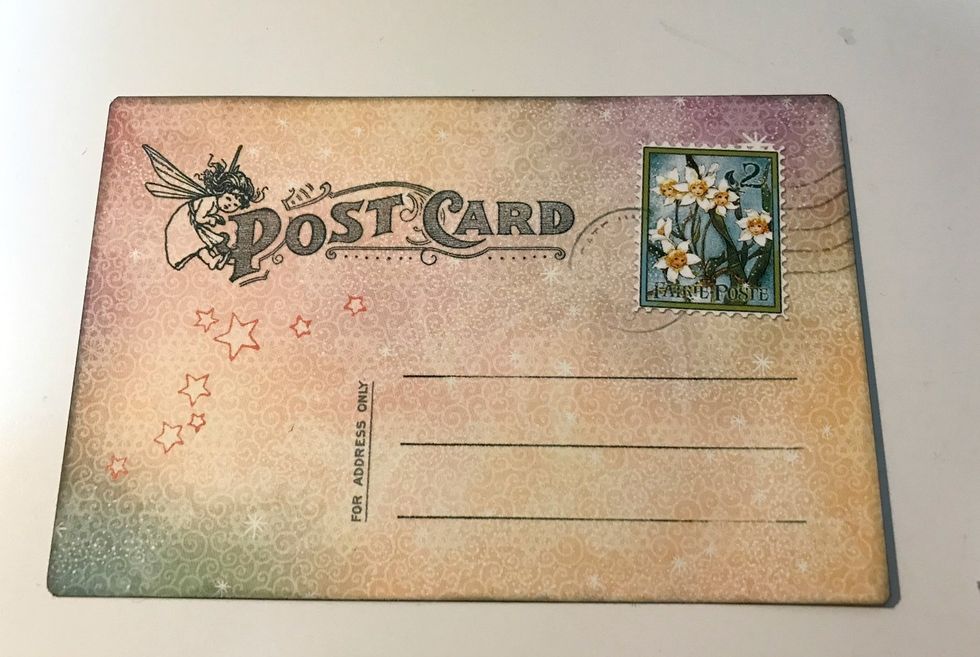 Pick out one of the 4"x6" ephemera cards. You'll use the back side of it. Ink the edges of the card using Photogenic Ink and a blending tool with foam.