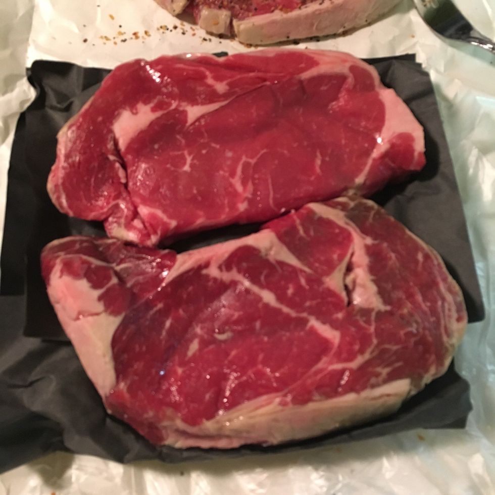 Pick out ribeye steaks with plenty of marbling
