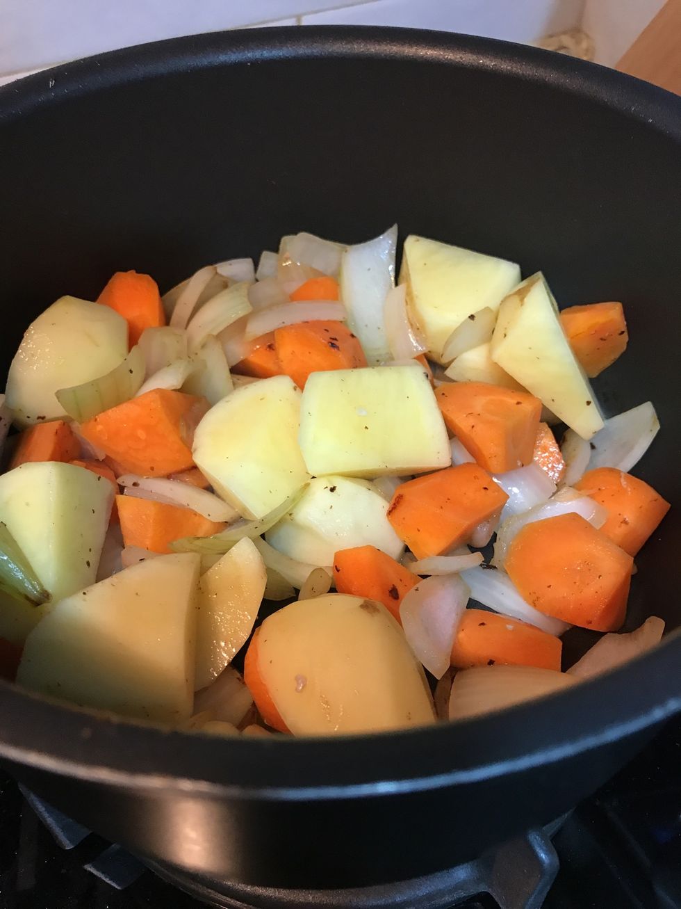 Pick the chicken wings up, brown the onion, carrot & potato in the saucepan