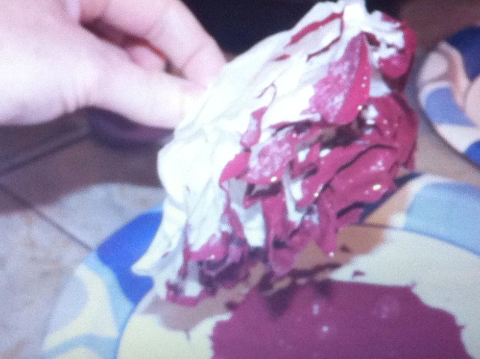 Pick up a flower by the staple and drag it thru the paint. Let the flower mix the paint.