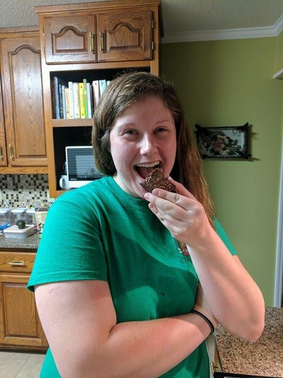 Pick up a square piece of brownie, eat, and enjoy!