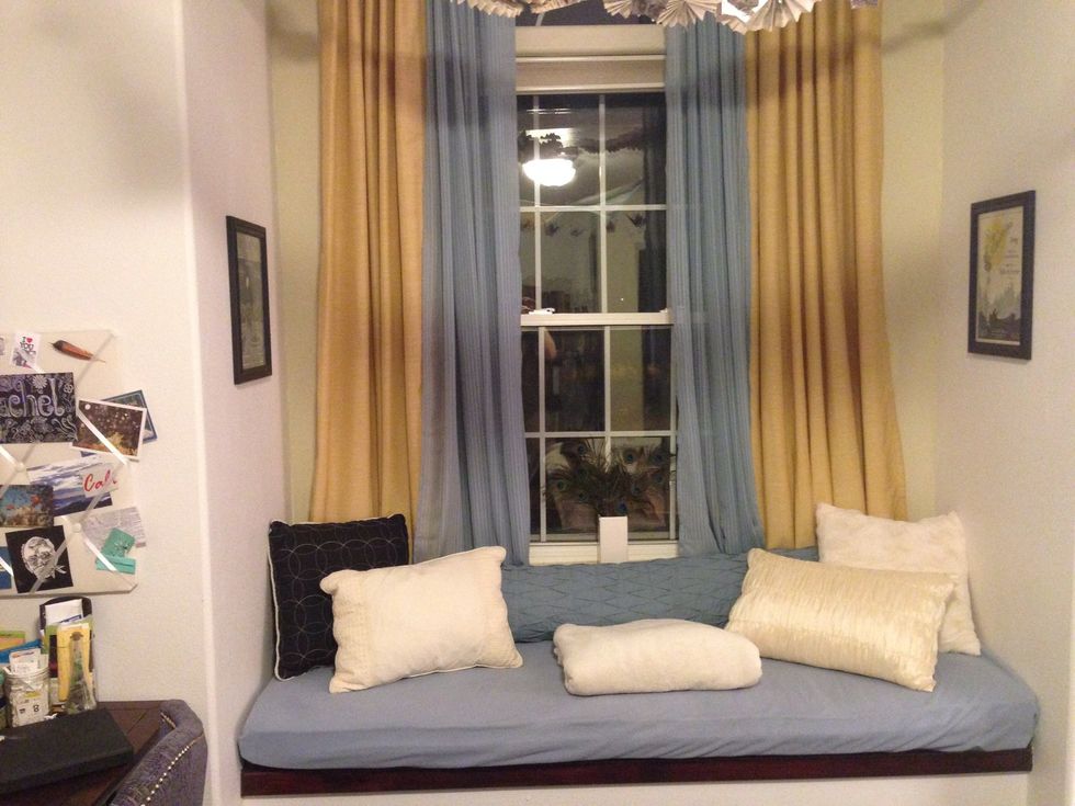 Pick up that same color palette in other areas of your room. I find that using a bright color instead of a neutral color with curtains really brightens the room.