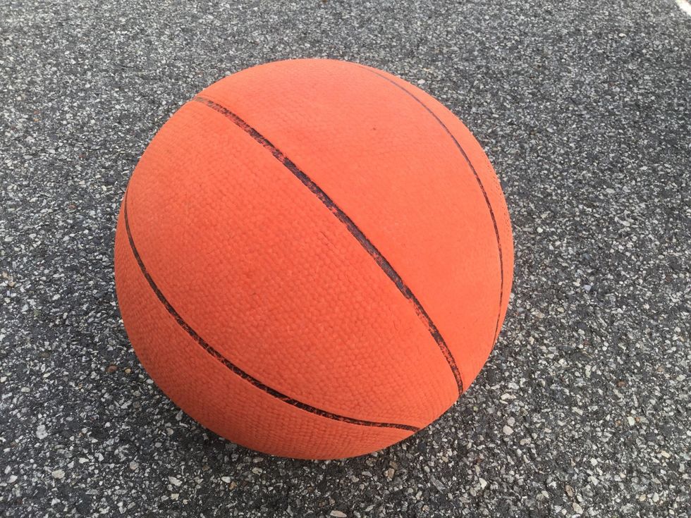 Bend your knees and put your undominant handon the left side of the