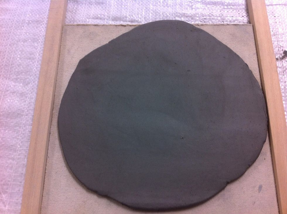 Pick up the slab and flip it and turn it like you would if you were rolling out a pie crust.