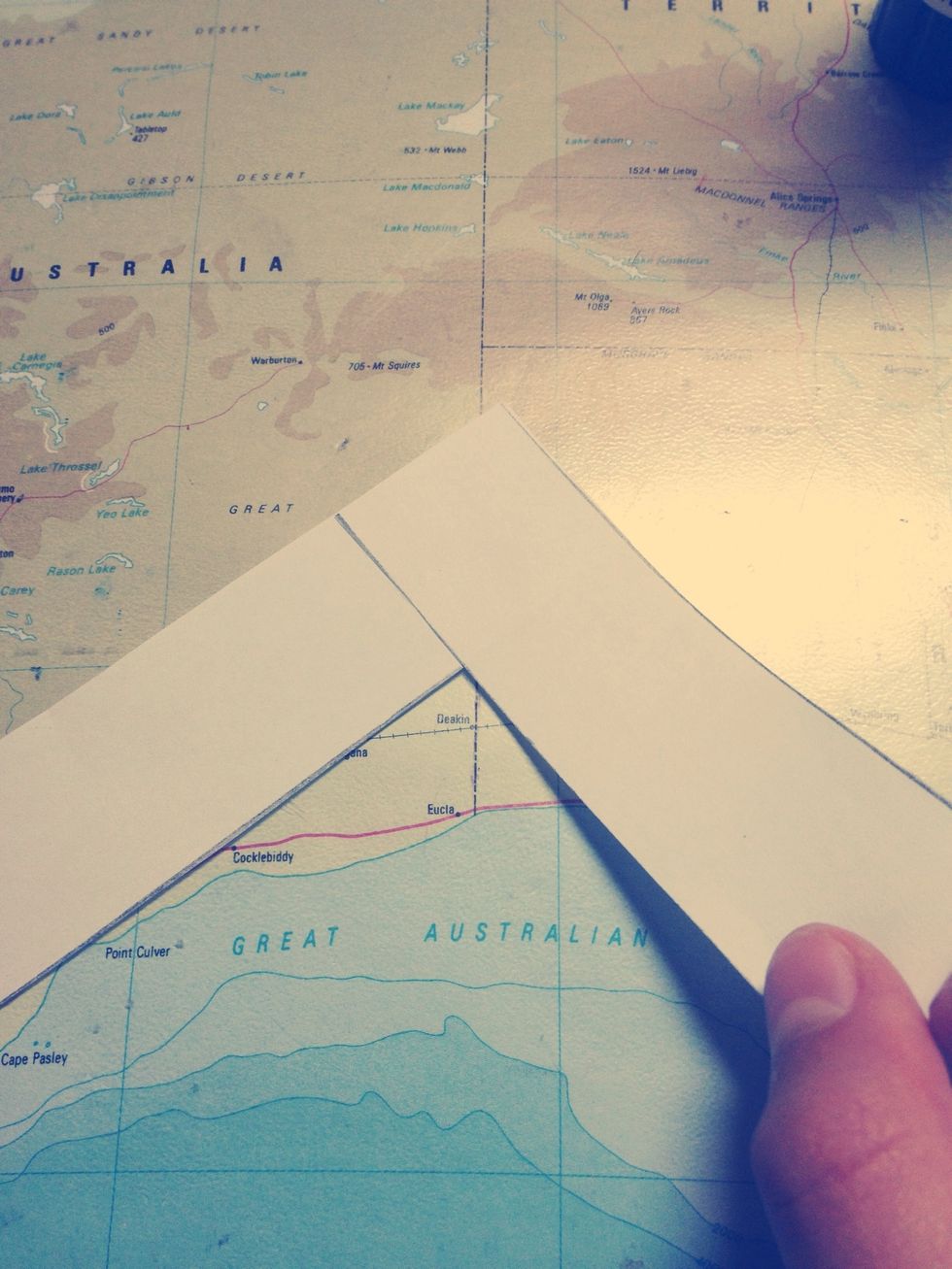 Pick up the strip that is glued on top of the other. So the top strip.