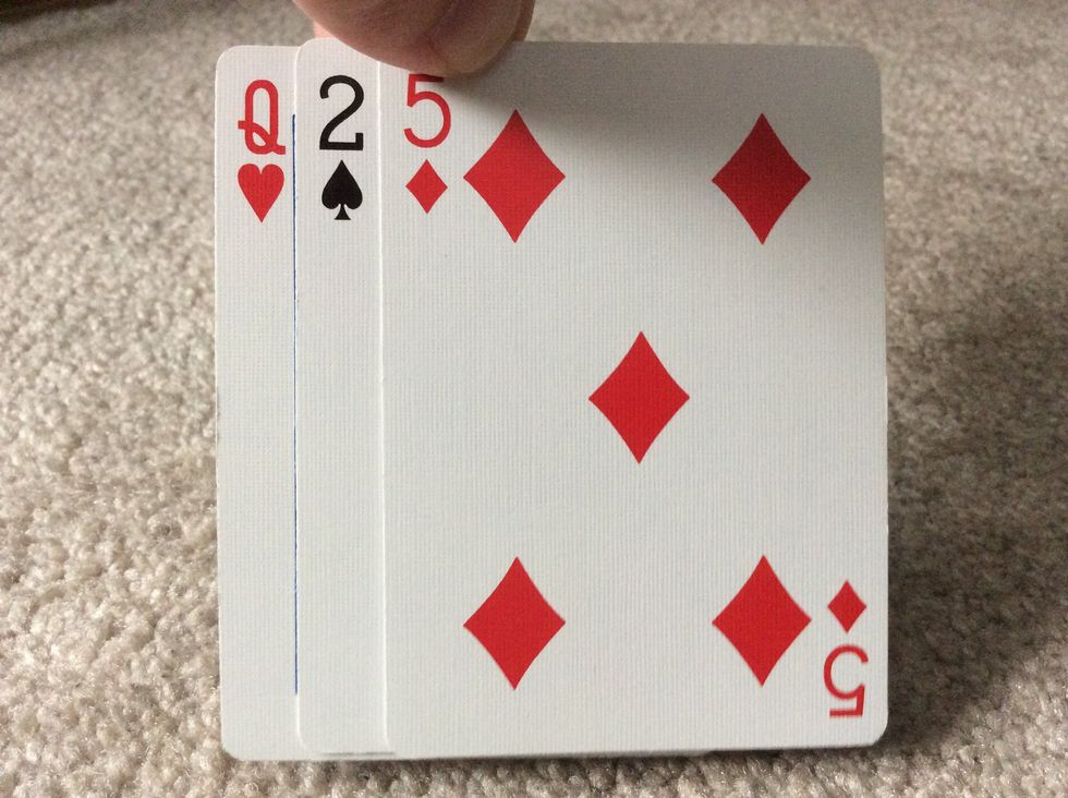 Pick up the three face down cards and show them to the spectator and ask if these were their cards. If they are, great job! If they aren't, order pizza and try this tutorial again!