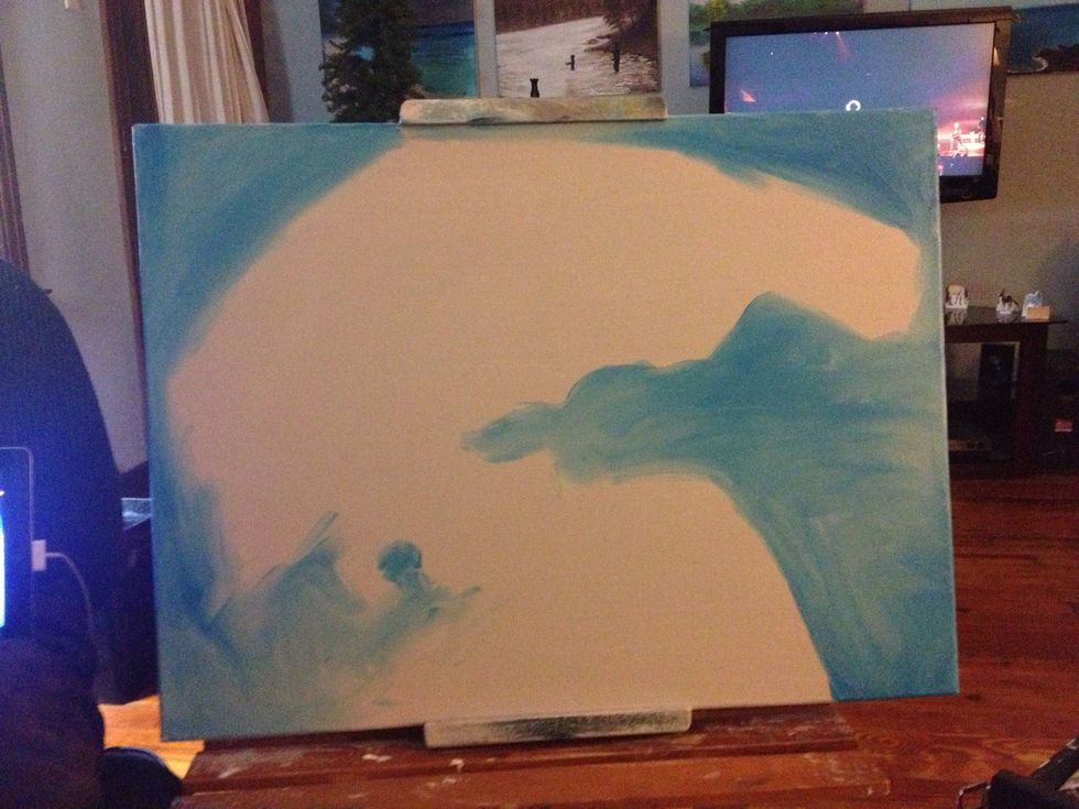 Pick up your plate with your darks and block in some color with a lighter value blue. It should be a big sweeping shape that frames the portrait like so.