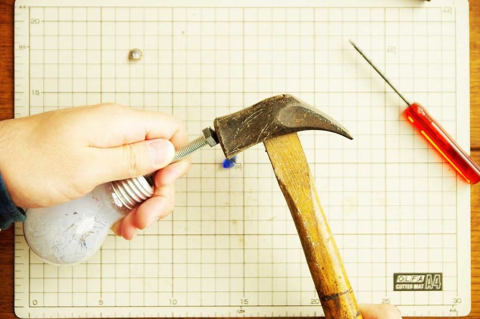 Pierce a filament in the light bulb.