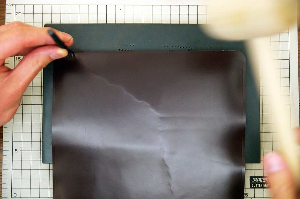 Pierce it with a hammer on the sewing line.