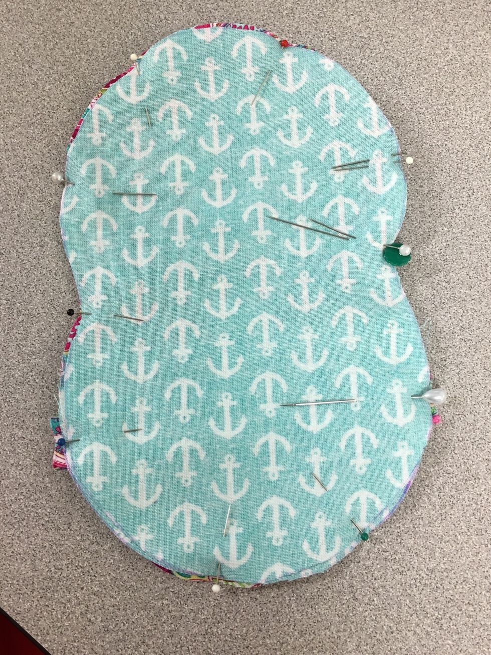 Pin all the way around, marking the spot for the opening using double pins. The opening should be on the straightest side possible. The space between the double pins will not be sewn.