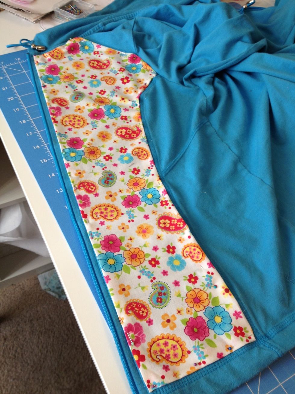 Pin and adjust size/cut excess.