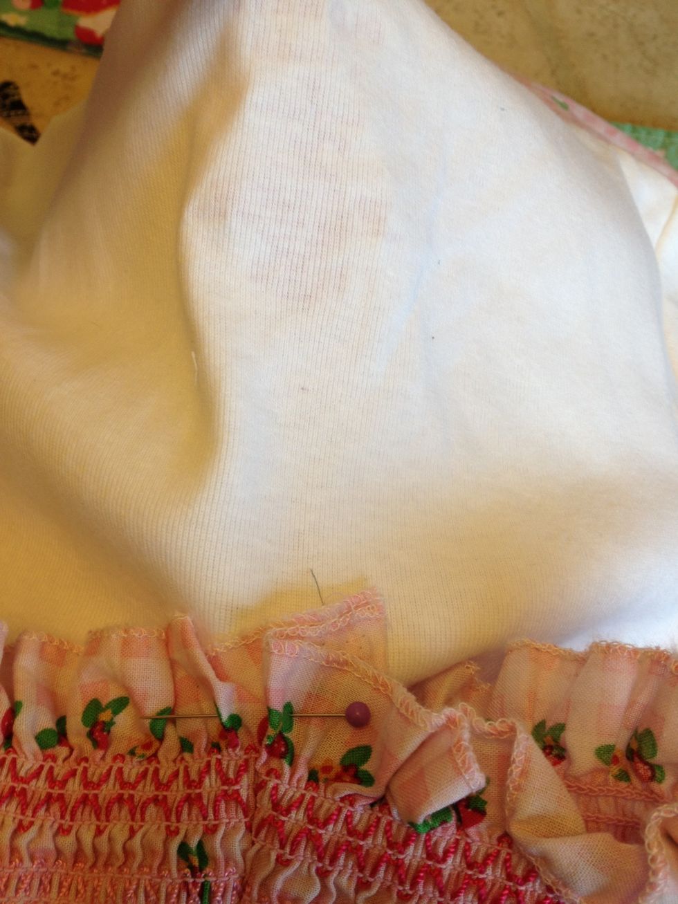 Pin back center of shirt and line up with back seem and pin