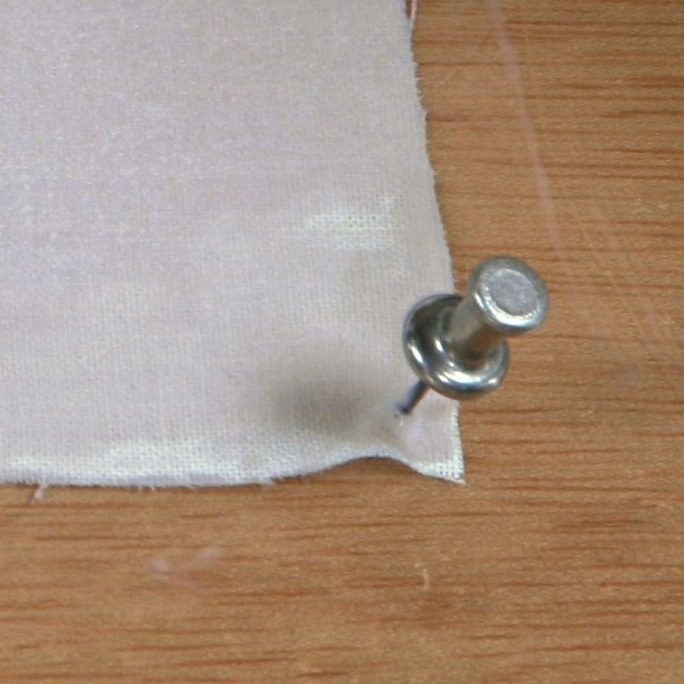 Pin down the edges of your fabric to prevent curling during exposure. Be mindful of the placement and angle of your pins- they may cast shadows on your print.