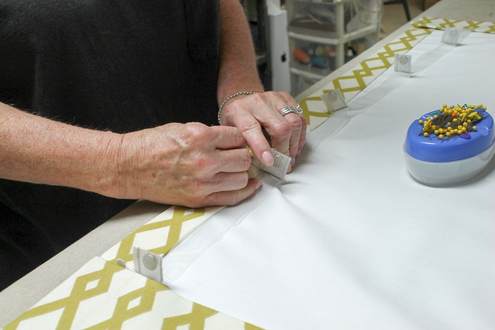 Pin each tab in place. The bottom magnet tab needs to be touching the bottom hem. The top magnet doesn't have to be at the very top.