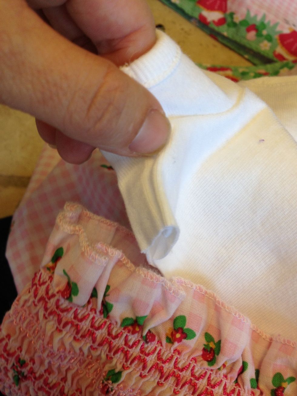 Pin side seems to dress, you may need to stretch dress a bit to lay shirt flat