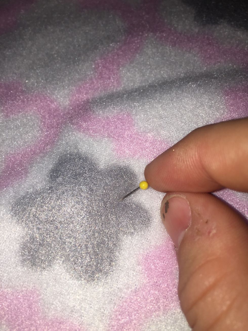 Pin the cloths together using sewing pins.