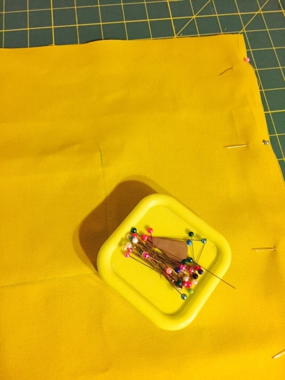 Pin the edges, but leave the top part open. Sew the outer edges.