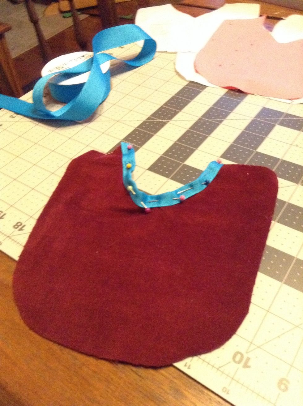Pin the ribbon onto the neck line.