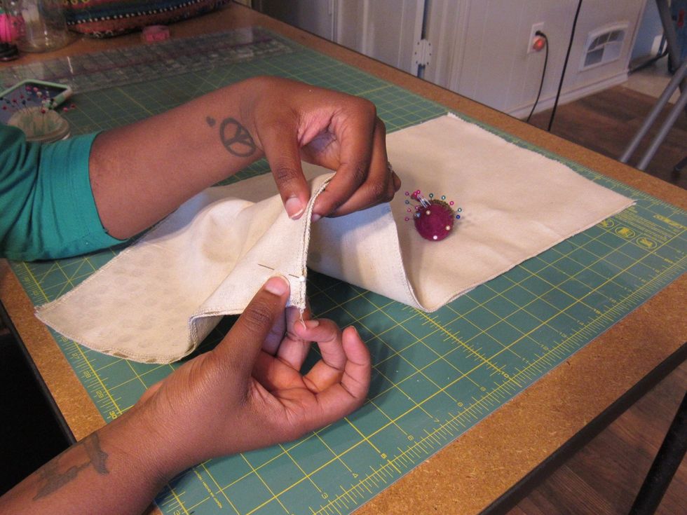 Pin the right side (long ways) together to hold fabric together for sewing.