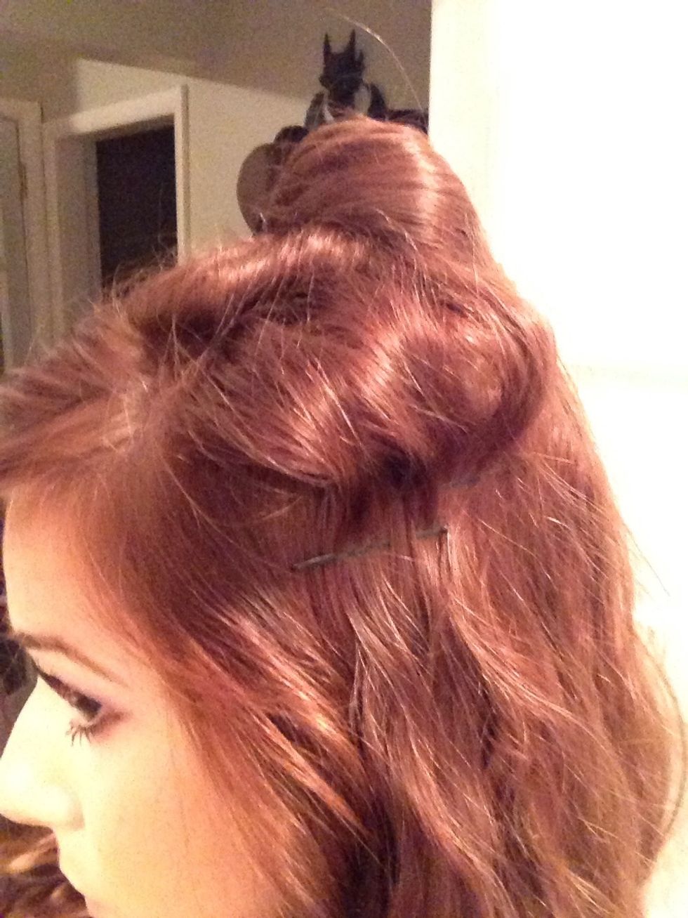 Pin the second layer over your finger to make a bulge or a semi circle just below your first layer