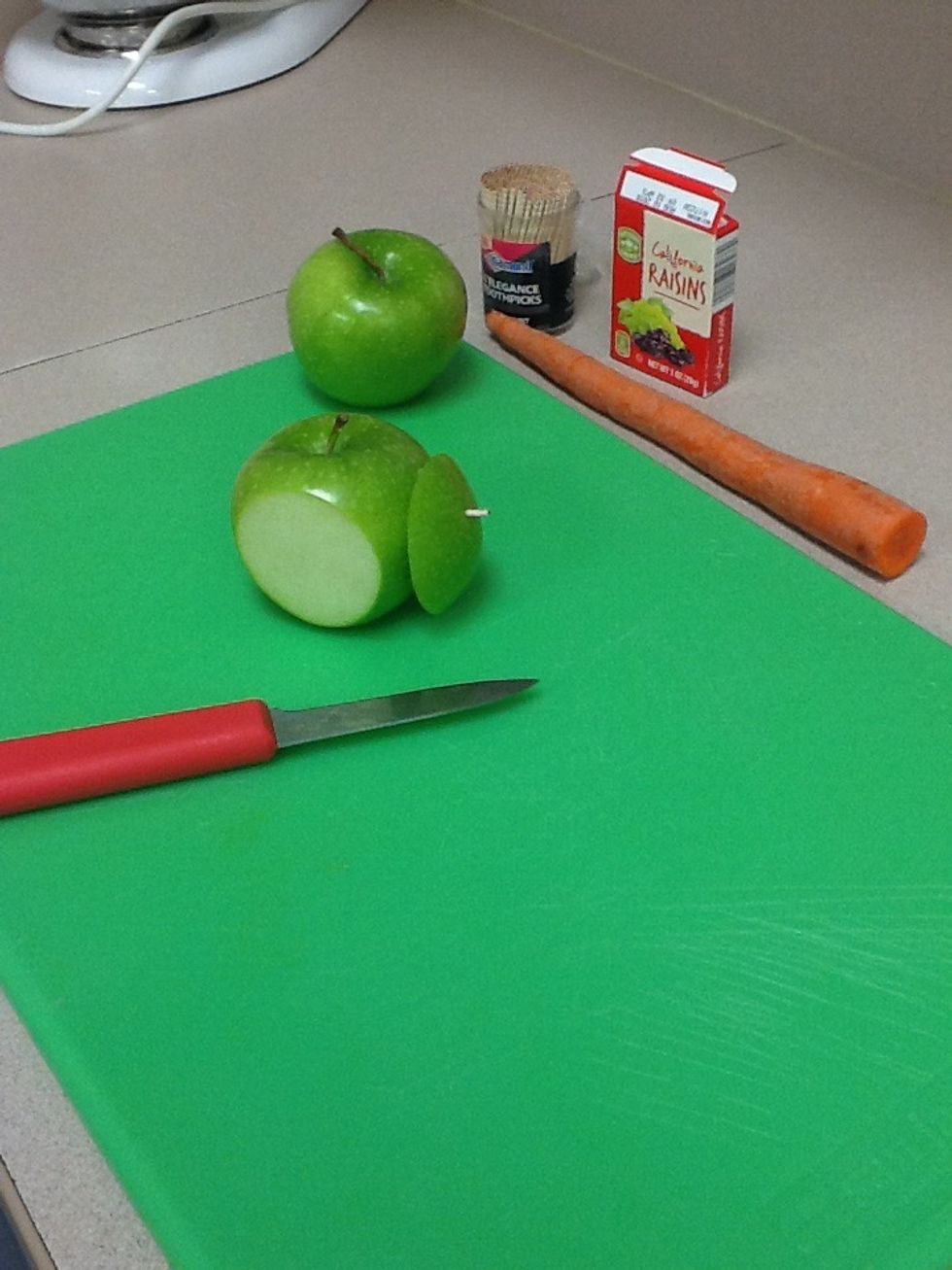 Pin the sliced apple to the apple with a toothpick