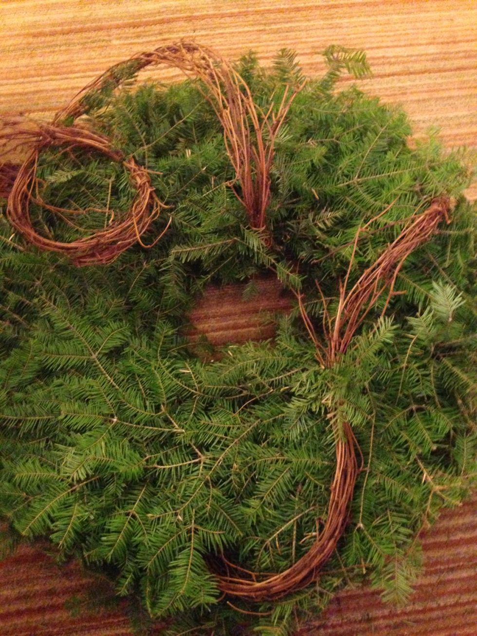 Pin, twist and wrap the grapevine garland around the wreath.