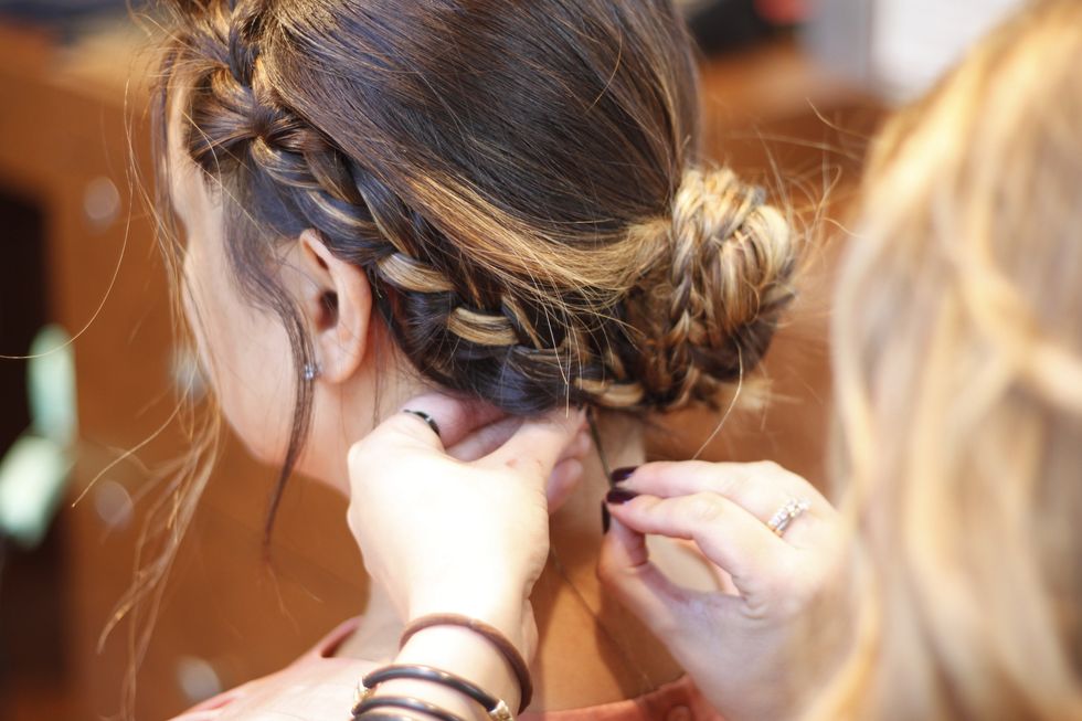 Pin up any pieces that are out of place, spray with hairspray to keep it together.