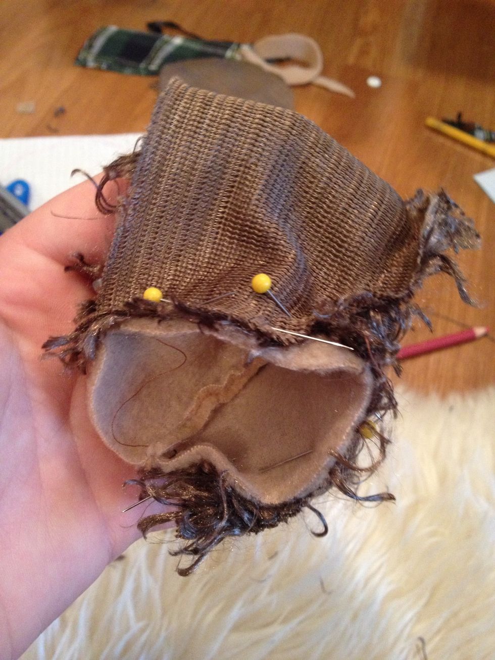 Pin your hedgehog's head to the body in a similar fashion as shown in the picture :)