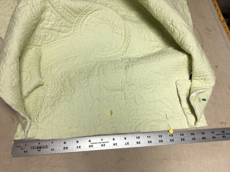 Pin your side tabs around to the back flap as they will be when it is finished.  The finished width of the back will now include some of the wrap around from the side flap.  Put a pin in the middle.