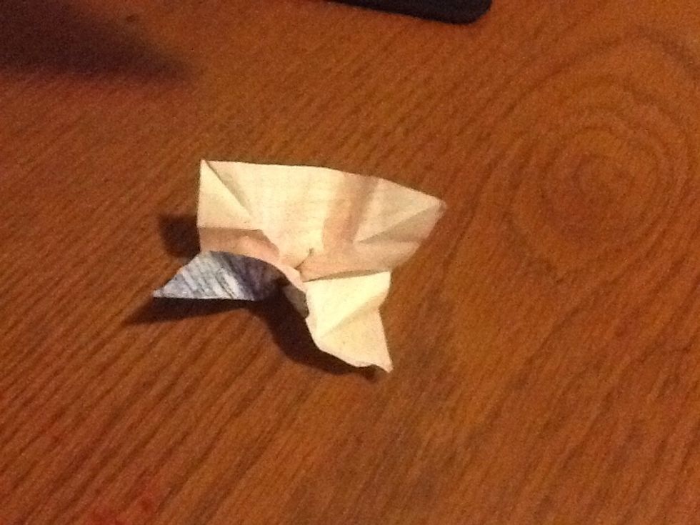 Pinch at the bottom middle.The creases will help you.