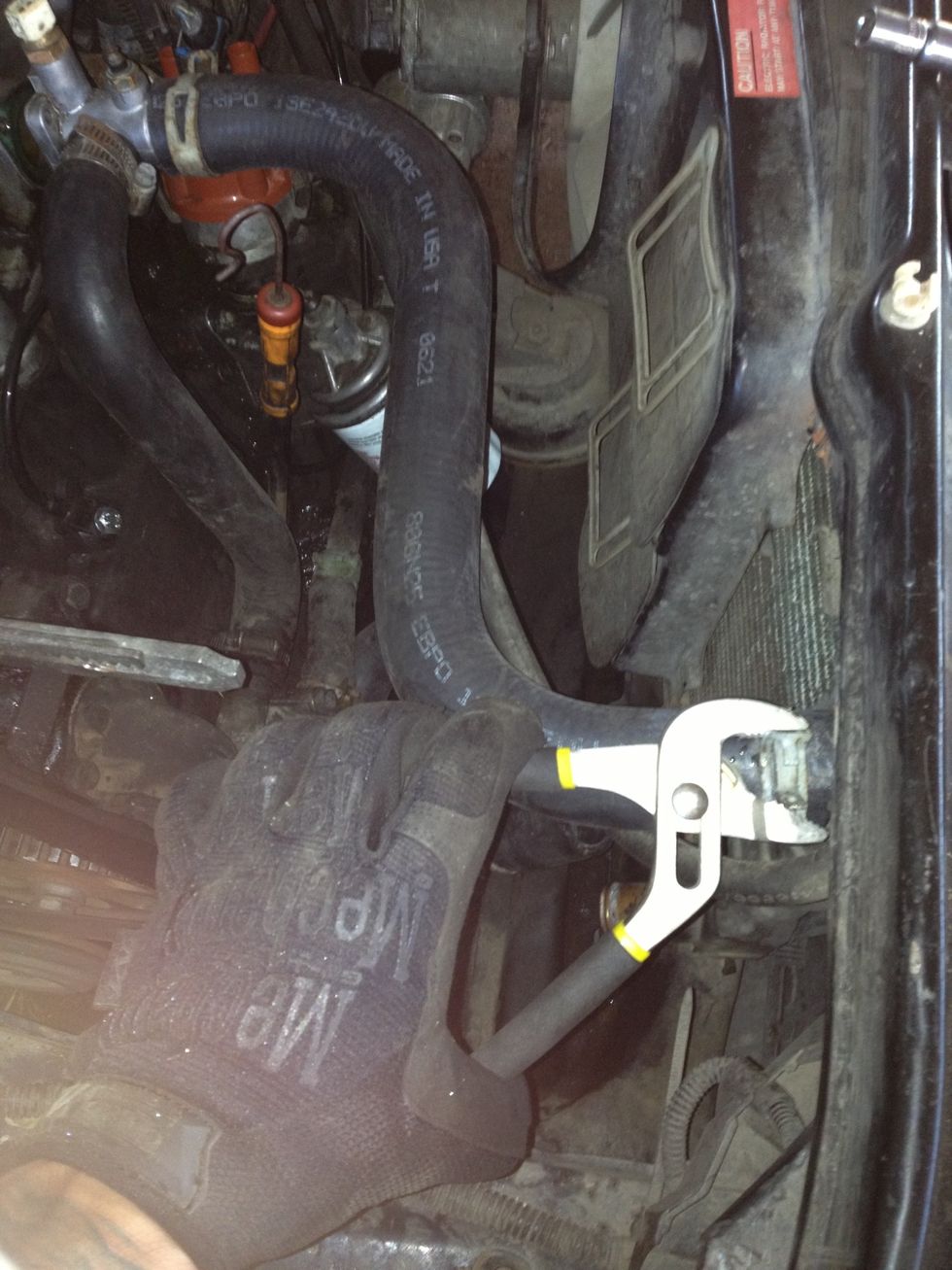 Pinch C-Clamp connecting top radiator hose to radiator...