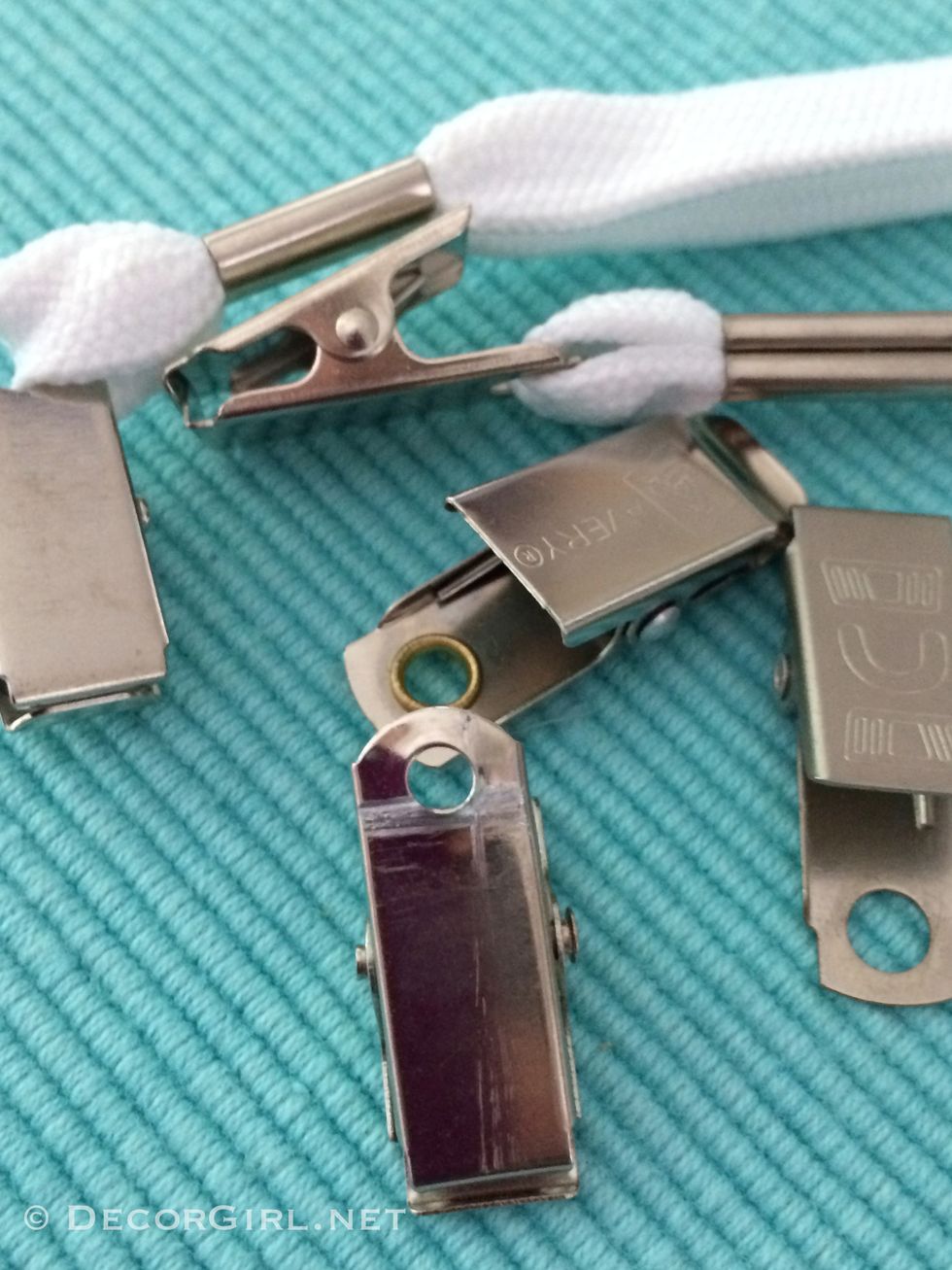 Pinch clips can be purchased from office supply stores but we took these from existing lanyards and name badges lying around the house.  Great project to recycle items!  We didn't spend a dime.