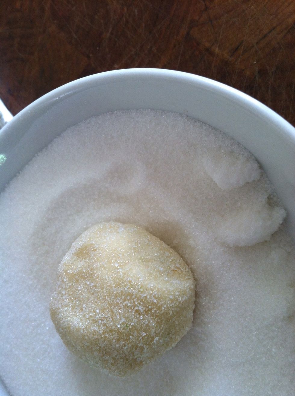 Pinch of 1/2" balls of dough, roll in sugar and place on cookie sheet.