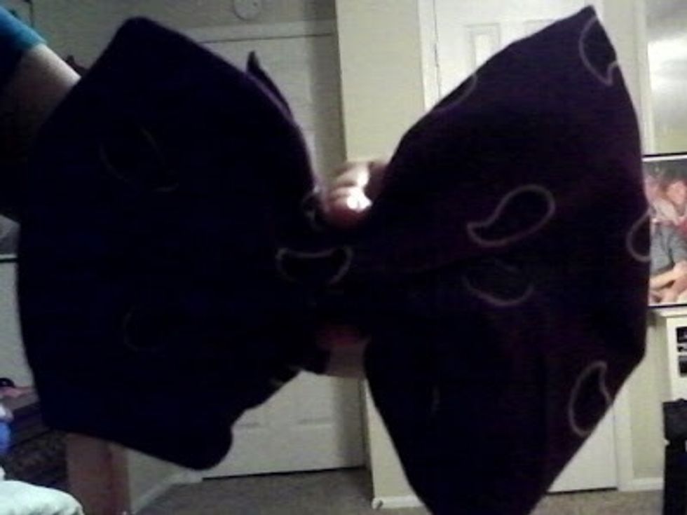 Pinch the bandana in the middle